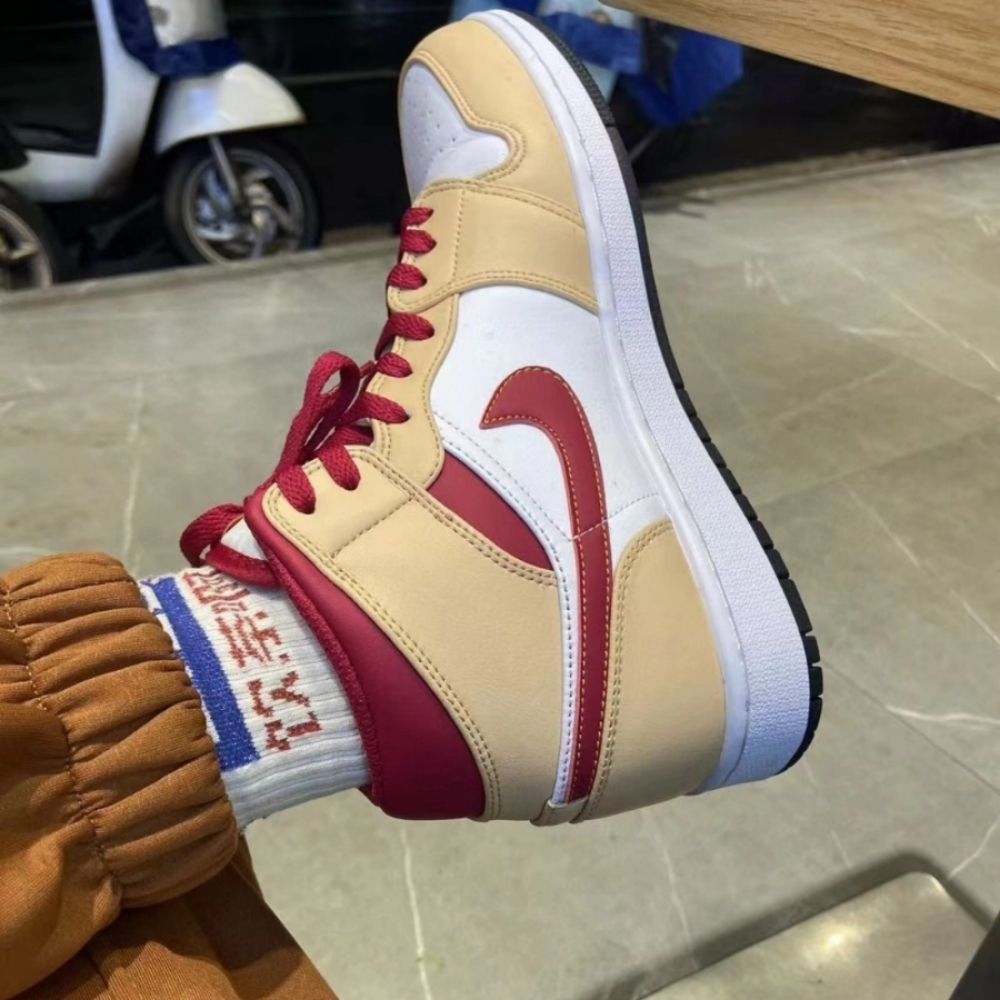 The Air Jordan 1 Mid Light Curry Cardinal